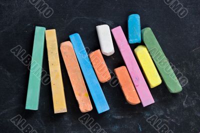 blackboard with coloured crayons