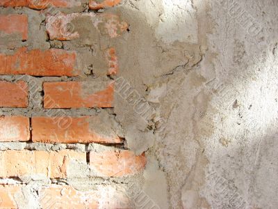 Wall of brick which was partly plastered