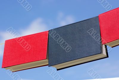 Books displayed with the blue sky