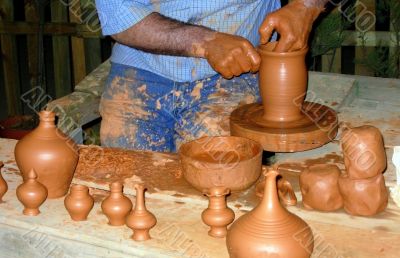 Potter working the adobe