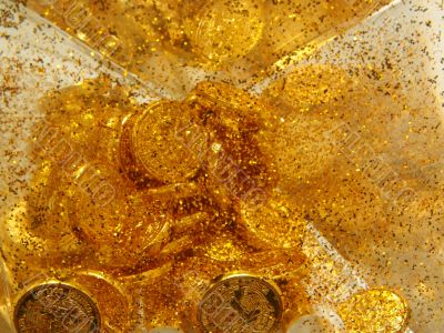 Gold sand and gold coins