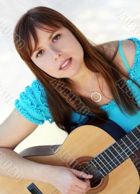 Woman playing guitar