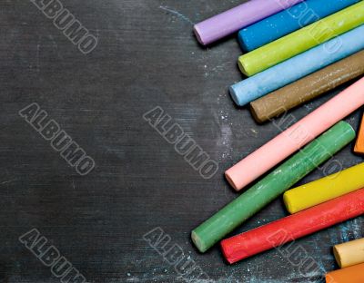 blackboard with coloured crayons