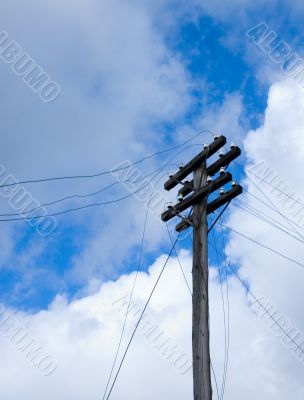 telegraph pole over blue sky background