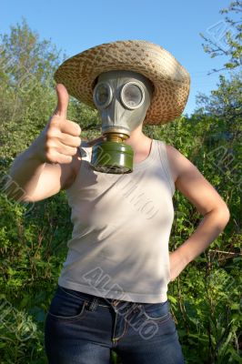 woman in gas-mask at garden work