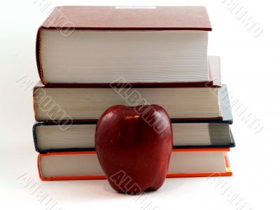 apple in front of books
