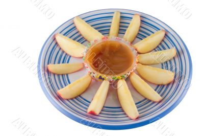 apple wedges with caramel dip on white