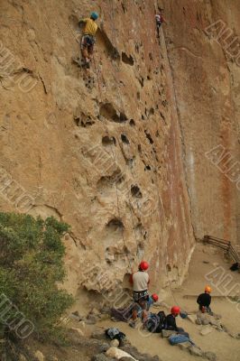 Potholes, climbers on rock face