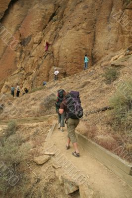 Climbers approaching rock face