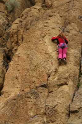 Young woman climbing