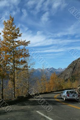 Car on narrow, twisty mountain road