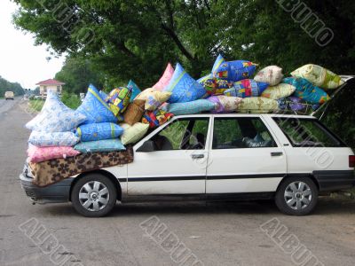 Cars loaded coloured bag on the sidelines