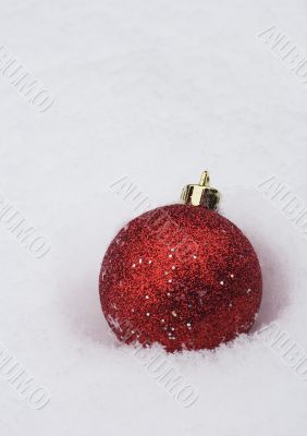 christmas bauble in white snow