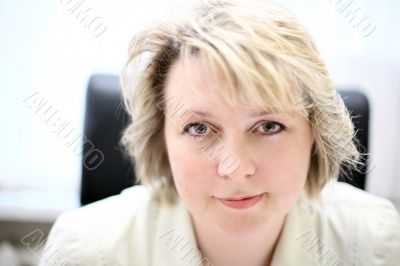 Mid-life business woman look at camera