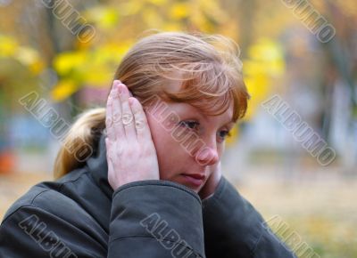 Woman cover your ears by hands