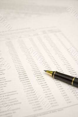 financial report and pen