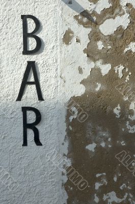 bar sign on grunge wall