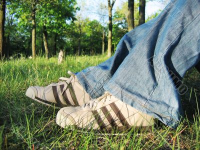 Running shoes and spring grass