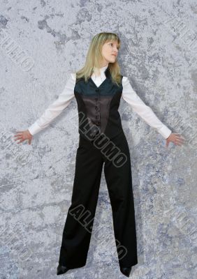 Business woman on grey wall
