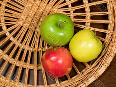 Apples on wicker plate
