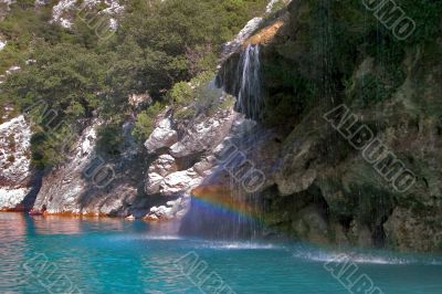 Rainbow in waters of a falls