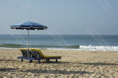 beach chairs and umbrella