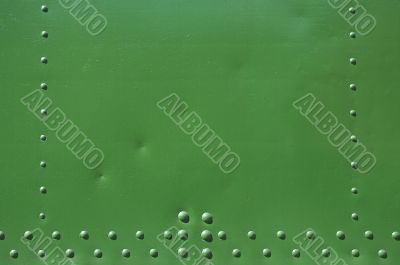 riveted green background with space for text