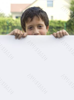 Boy keeps sheet of paper
