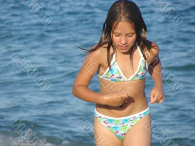 The girl running out from the sea