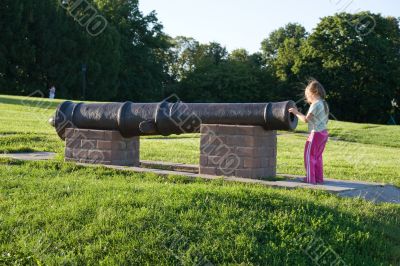 Old gun and girl
