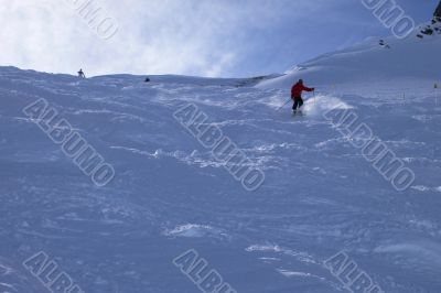 Red skier in powder snow