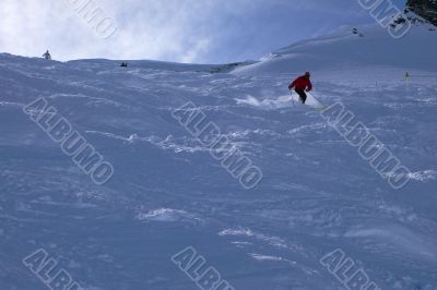Red skier in powder snow