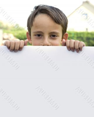 Boy keeps sheet of paper