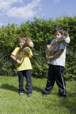 brothers playing on the  horn
