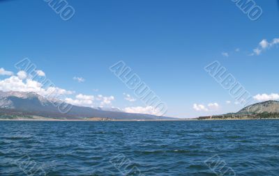 Lake surrounded by mountains in the summer