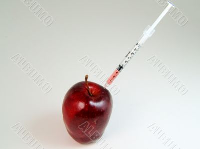 Red apple getting injection