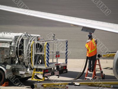 Man refueling commercial jet