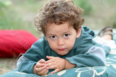 young boy on a mattress