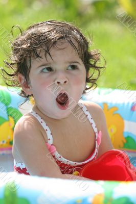 Crying girl in a pool