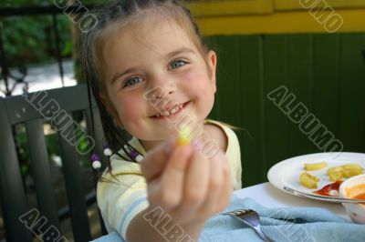 Girl eating french potato