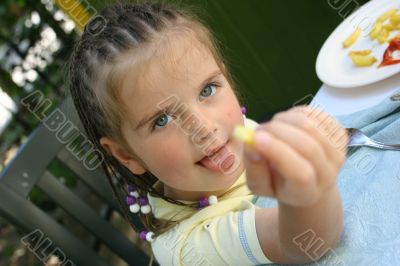 Girl eating french potato