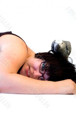 woman laying with grey parrot on her head