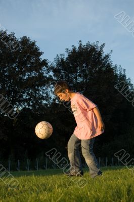 boy plays with ball