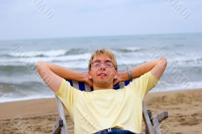 young man on sea beach in longue