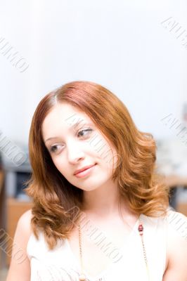 Smiling pretty brunette in office