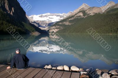Lake Louise with Man sitting on a dock