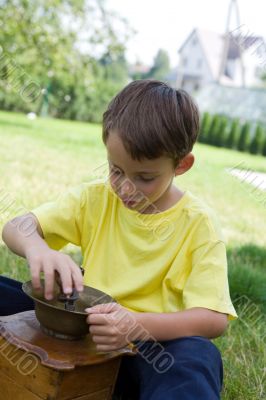 Boy and coffee mill