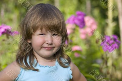 Portrait of little smiling girl outdoors