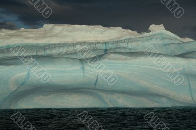Iceberg with surrealistic blue swirls,