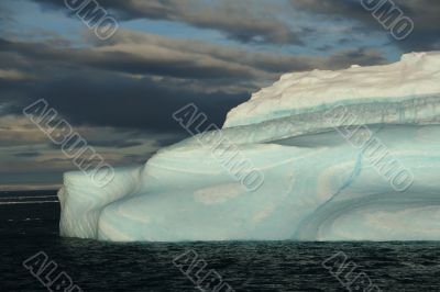 Iceberg with surrealistic blue swirls,